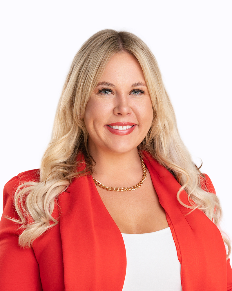 Professional headshot of Alicia Branch, real estate investor and co-founder specializing in property acquisitions, renovations, and investment strategy