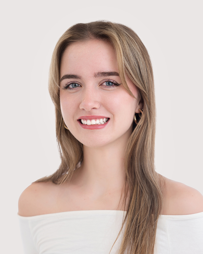 Bright and welcoming headshot of Mylie Foss, licensed esthetician at Mac Aesthetics in Edmond, OK.