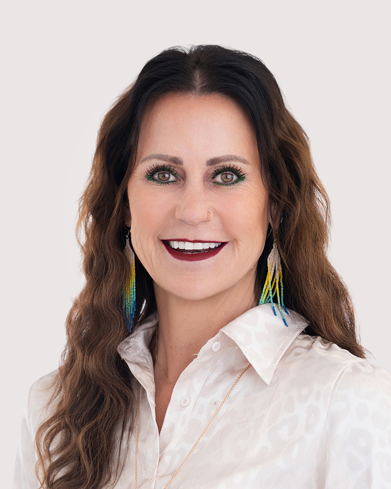 Friendly headshot of Jamie Sylvester, patient coordinator and office manager at Mac Aesthetics in Edmond, OK, smiling.