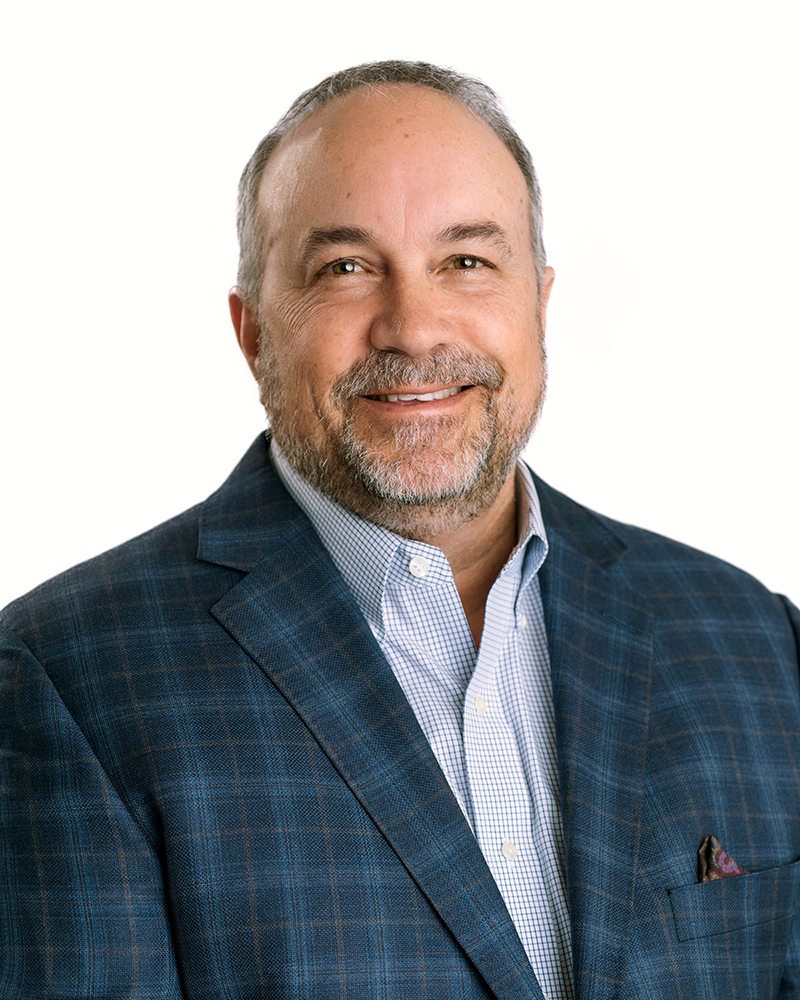 Contemporary studio-lit headshot of Bobby Luber taken at Rose + Salt Studio, featuring even lighting and a clean, professional environment.