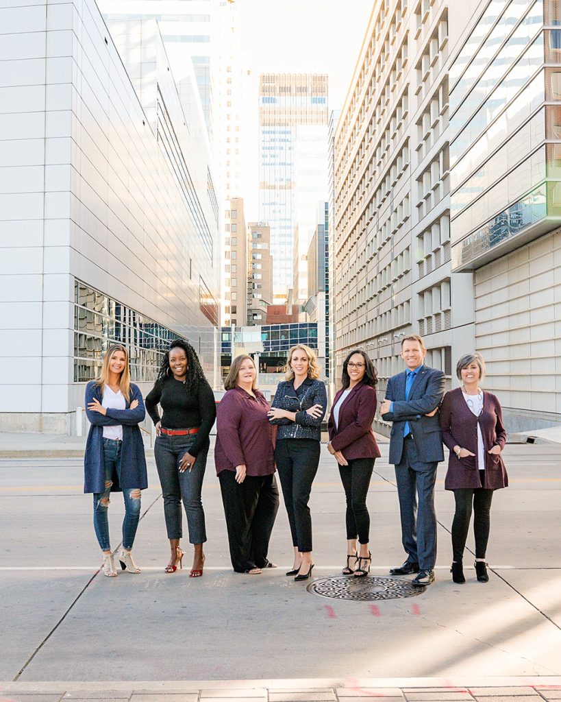 Realtor group photo with Oklahoma City buildings in background