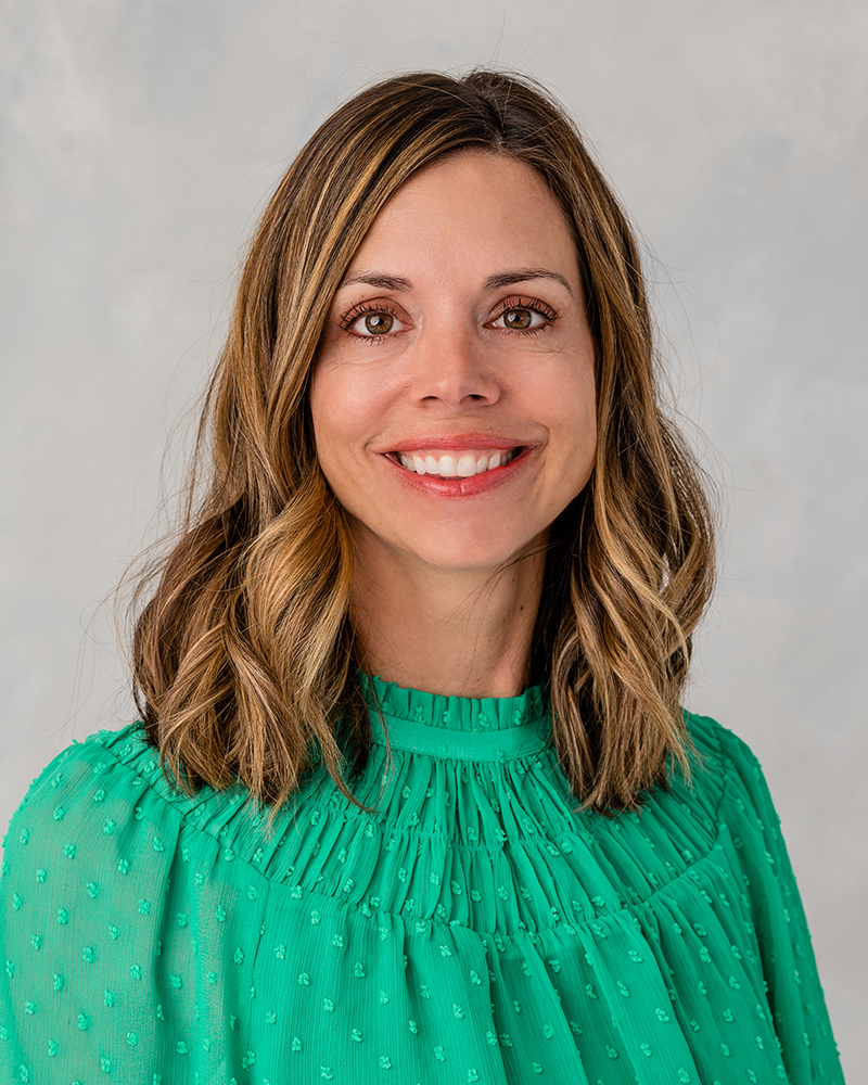 Professional headshot of Stacy Scherm taken at Rose + Salt Studio with studio lighting, photographed by J. Hill Photography for a polished, high-end look.