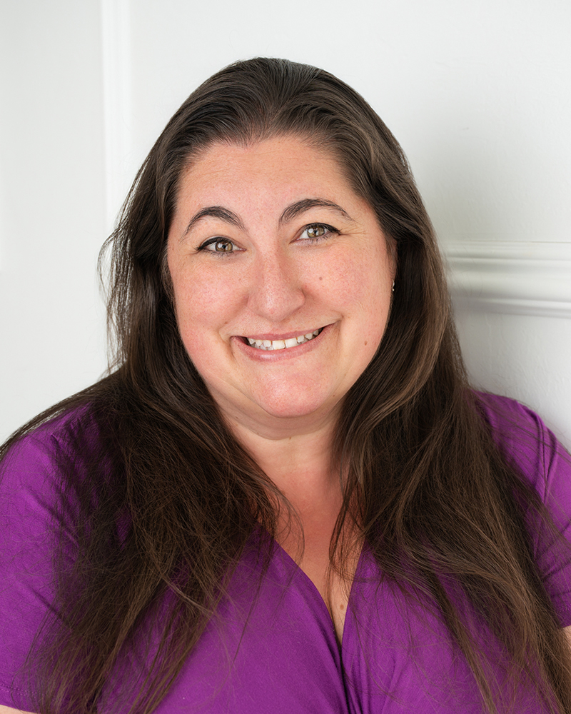 Friendly headshot of Kamry Murrell, office administrator at Wallis Law Group, providing client support and administrative coordination.