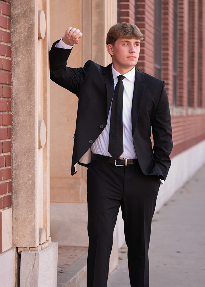 Williams senior session in downtown Oklahoma City. His expression conveys confidence and contemplation.