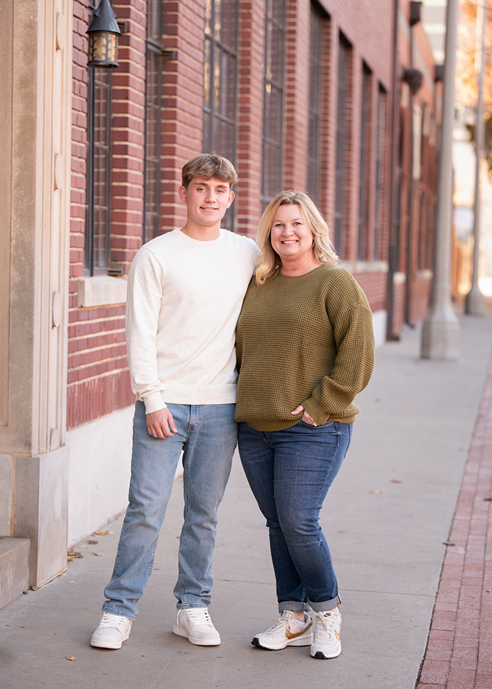 Mom and son at a senior photo session in an urban setting.