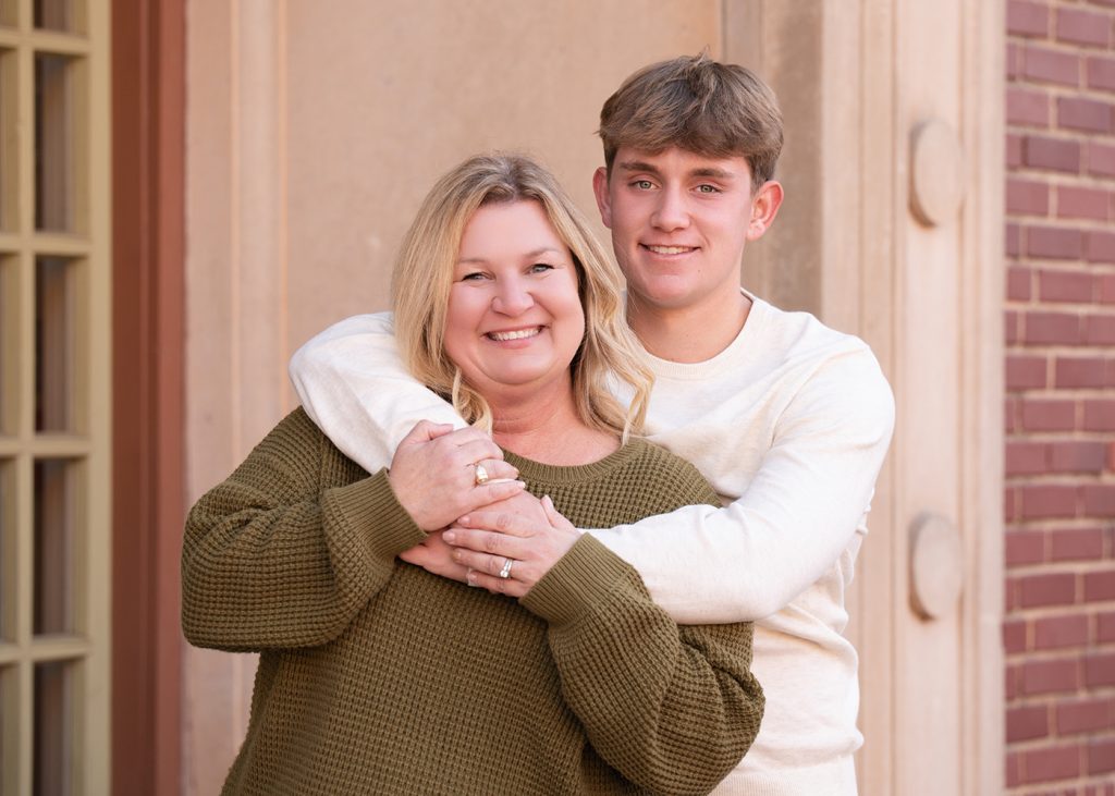 Mom and son at a senior photo session in an urban setting.
