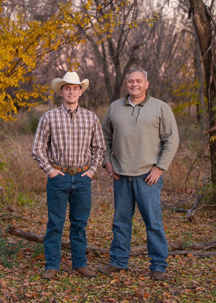 High school senior with his dad during his senior photo session.