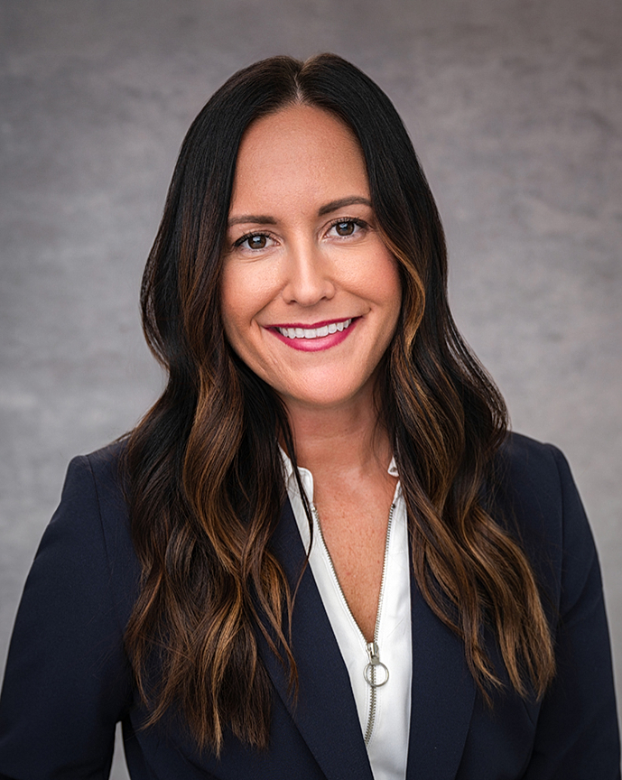 Professional attorney headshot of a woman in a suit at Rose + Salt Studio by J. Hill Photography