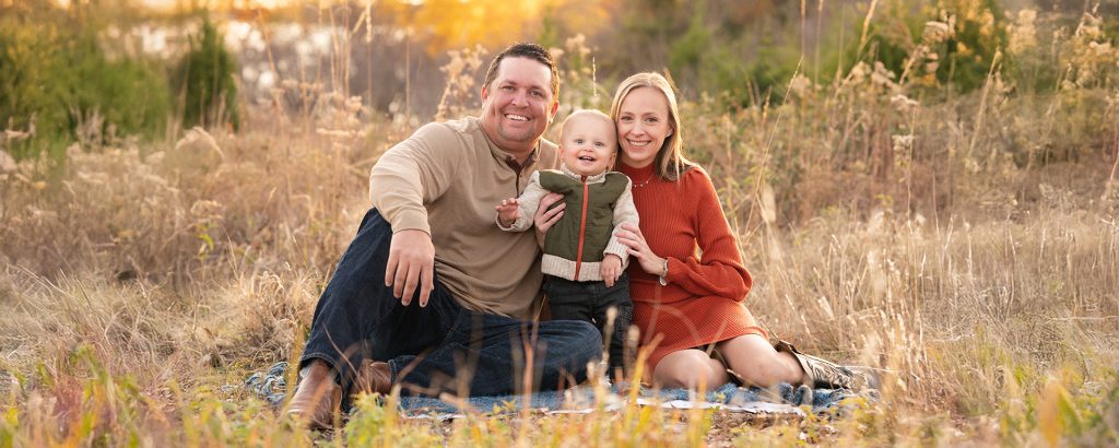 Edmond family photographer capturing joyful outdoor family portraits in golden light
