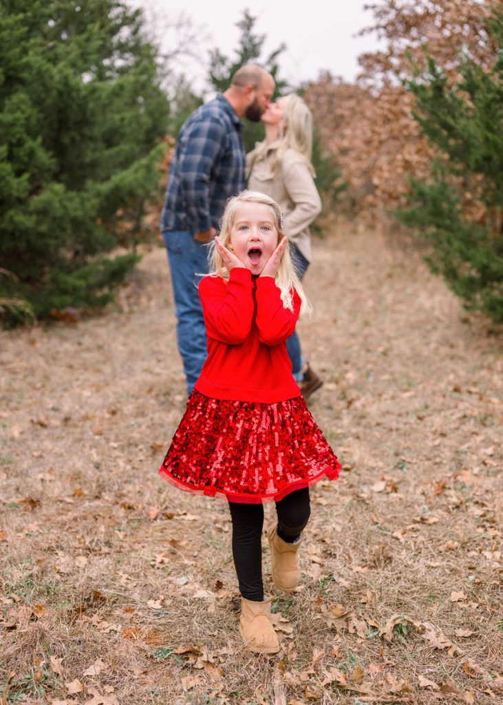 Young girl making a playful expression during a family photo session