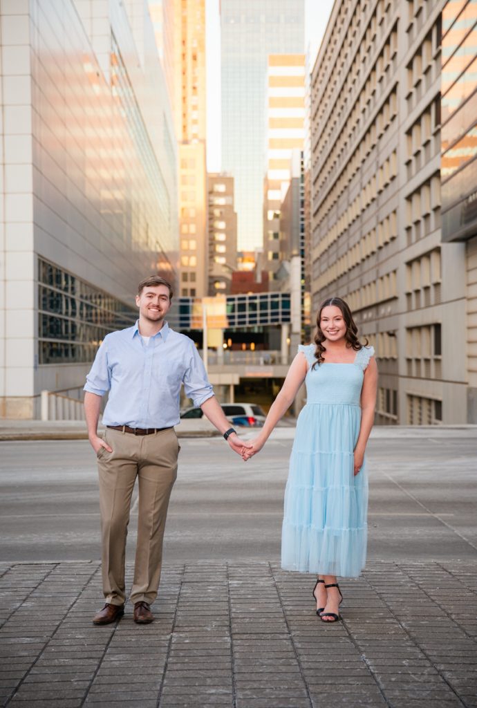 Couple holding hands during a portrait session in downtown Oklahoma City