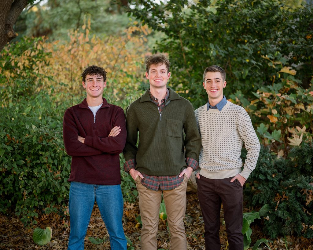 Three brothers standing together during a fall family photography session in Edmond, Oklahoma.