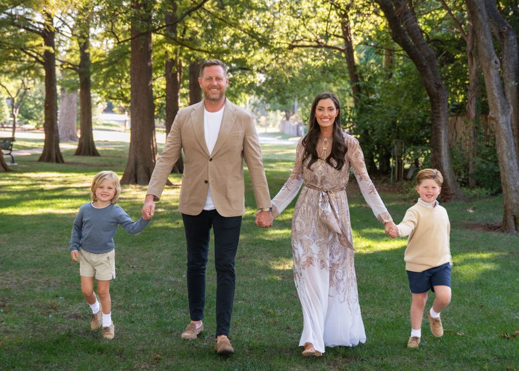 Mom wearing a long flowy neutral dress during an Oklahoma family photo session