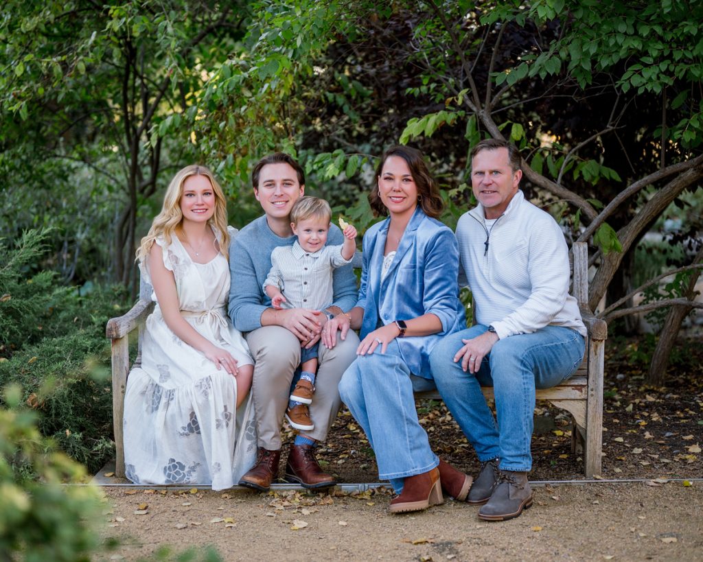 Three generations gathered together for an outdoor family portrait session