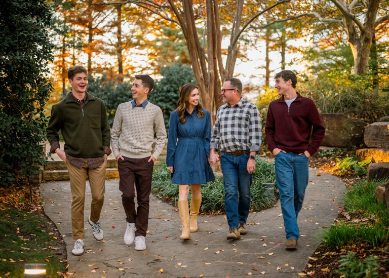 Family walking together during a fall family photo session in Oklahoma City