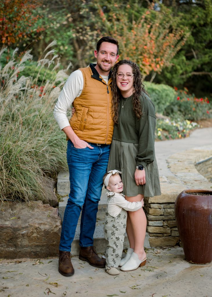 Young family with toddler during an outdoor family photography session in Edmond Oklahoma.